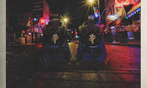 PIcutre of two Shoes on the street with the words "ballin on Beale" acorss the bottom