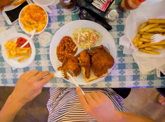 Girl eating Gus's Fried Chicken