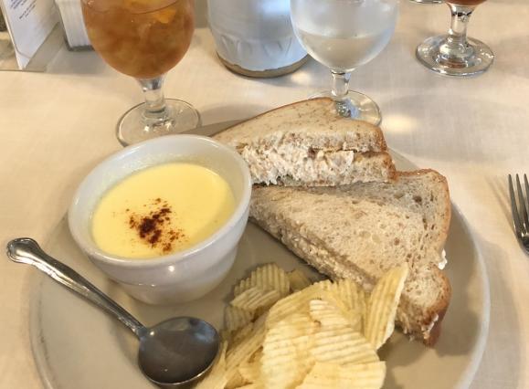 lunch plate of corn chowder, chicken salad sandwich, and potato chips