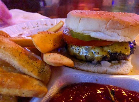 cheeseburger with seasoned fries from Alex's Tavern