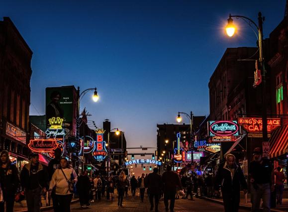 beale street at twilight with crowds and home of the blues sign 