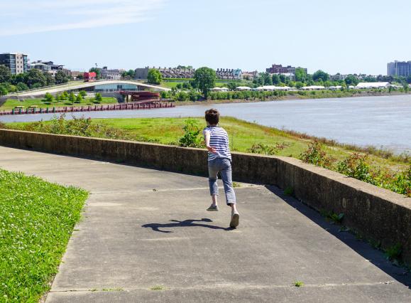 Kid Running by River