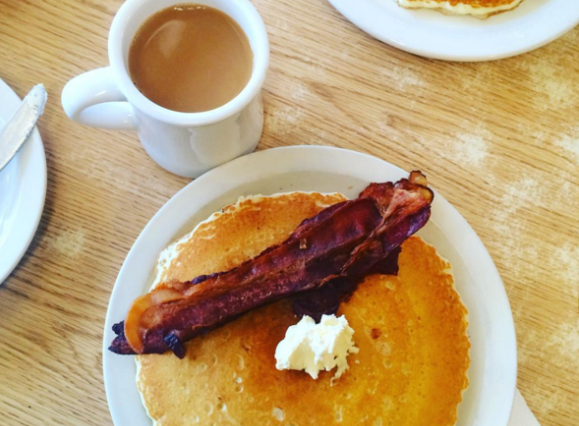 pancake with slice of bacon and coffee at the Pancake Shop