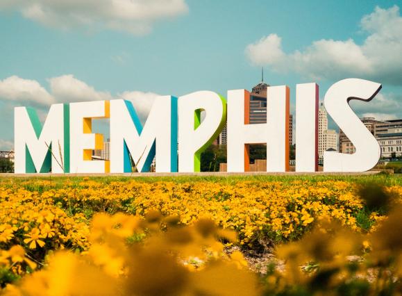 memphis sign on mud island with yellow flowers