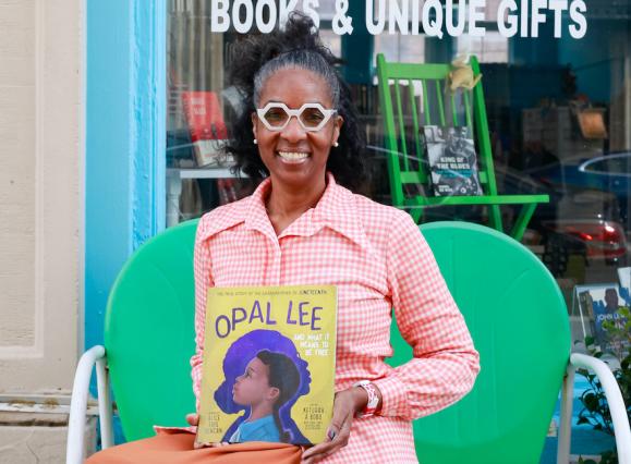 author holding children's book