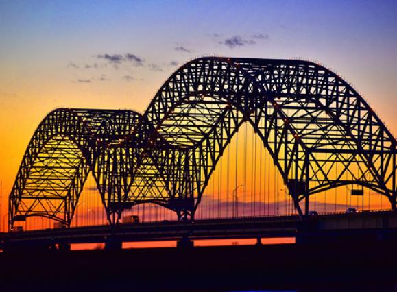 Memphis bridge during the sunset with orange and blue skies