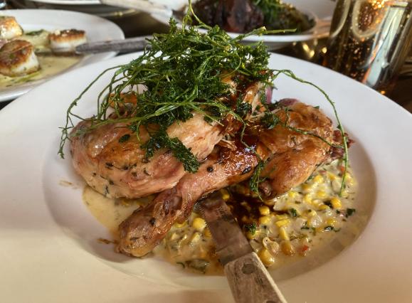 brick chicken on a bed of smoked cream cheese