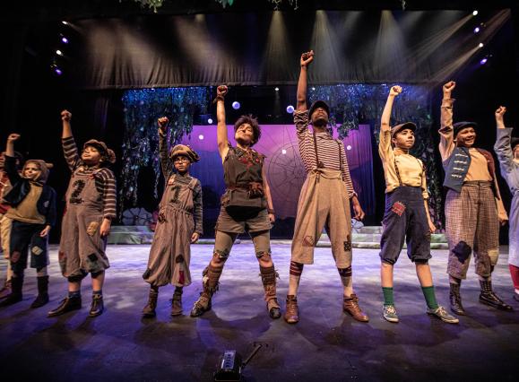 performers on stage posing