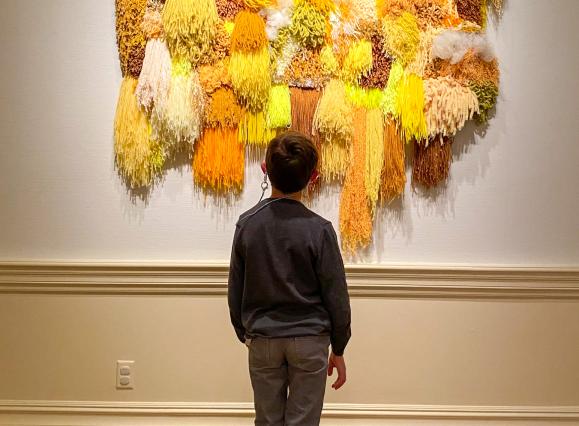 Kid enjoying art at The Dixon