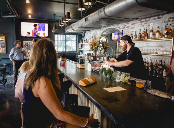 people sitting at bar at BarWare