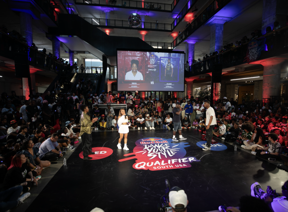 Red Bull dance stag set up in crosstown concourse surrounded by spectators