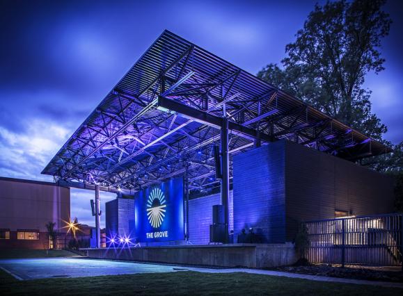 The Grove stage at GPAC lit up blue at night