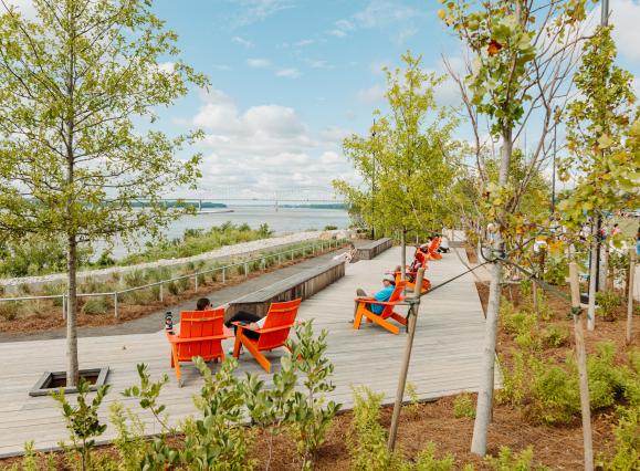 lawn chairs line the Mississippi River at tom lee park