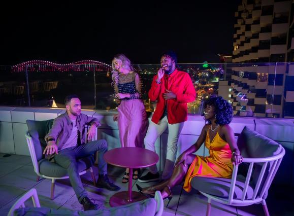 Friends at the rooftop bar Beck and Call at Hyatt Beale Street Memphis.