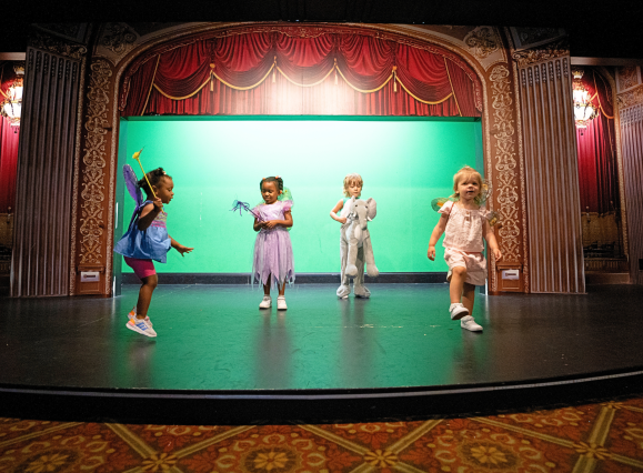 kids play on theatre stage at children's museum of memphis