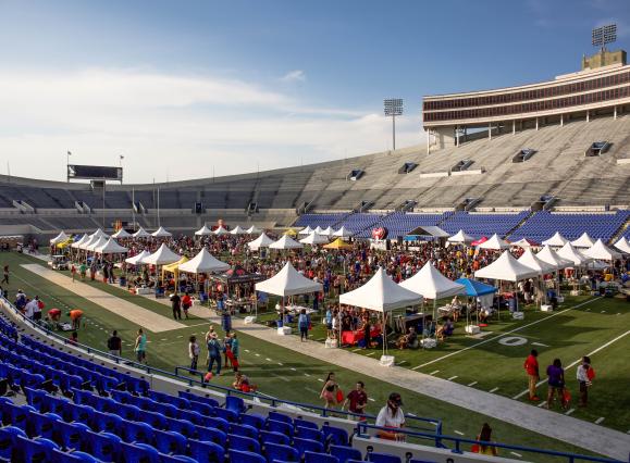 dozen plus pop up tents set up on field inside Simmons Bank Stadium for chicken and beer festival
