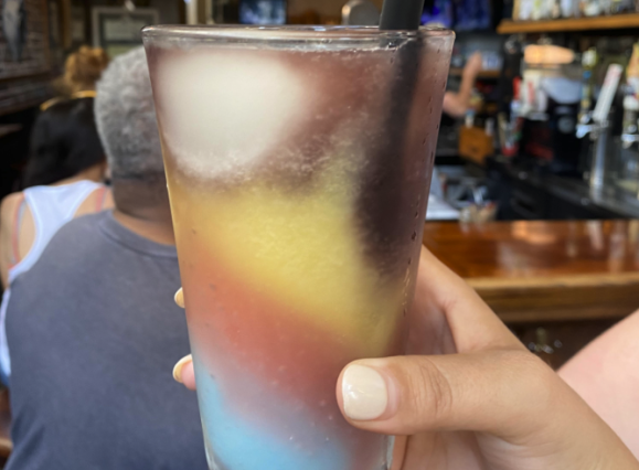 multi-colored slushie in glass