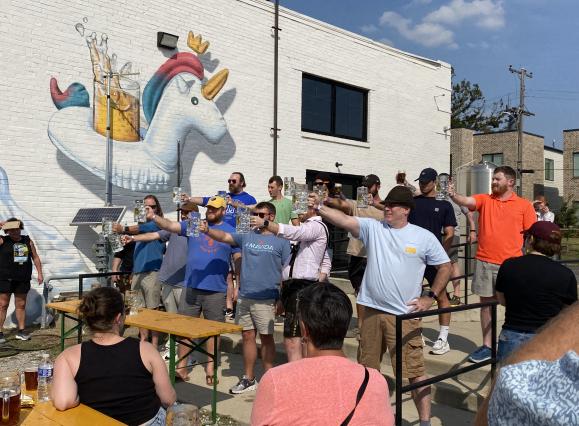 men compete in stein holding competition at soul & spirits