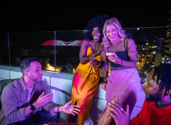 Friends at the rooftop bar Beck & Call at Hyatt Beale Street Memphis