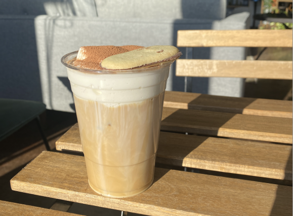 coffee on table at dr. beans with a biscoff cookie on it