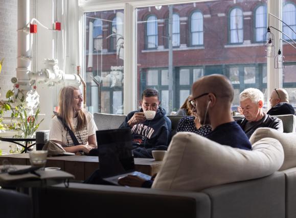 people sitting and enjoying coffee at Dr. Bean's
