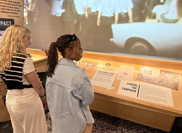 two women view poor people's campaign exhibit at NCRM's new Legacy Experience expansion