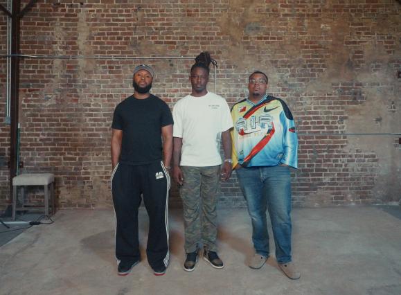 three african american men standing side by side looking into the camera, alexander, saint, and luther of tapped in 901
