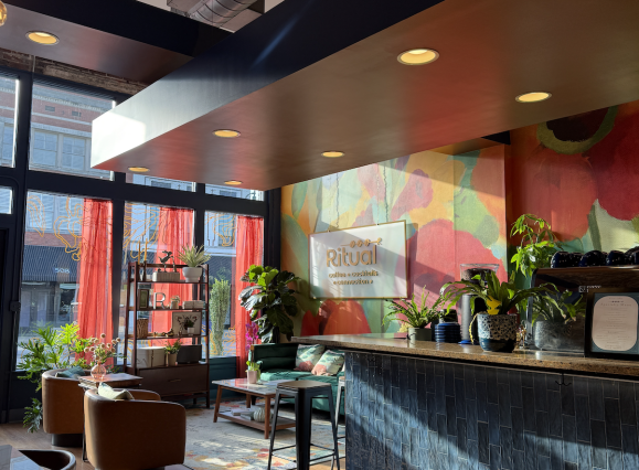 ritual coffee dining space and sidebar with colorfully painted wall
