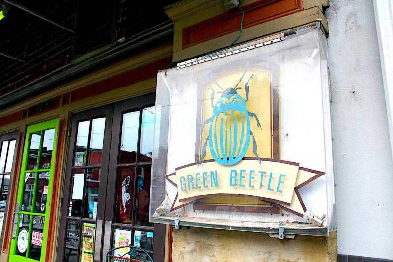 sign shaped like a beetle stating &quot;Green Beetle&quot;