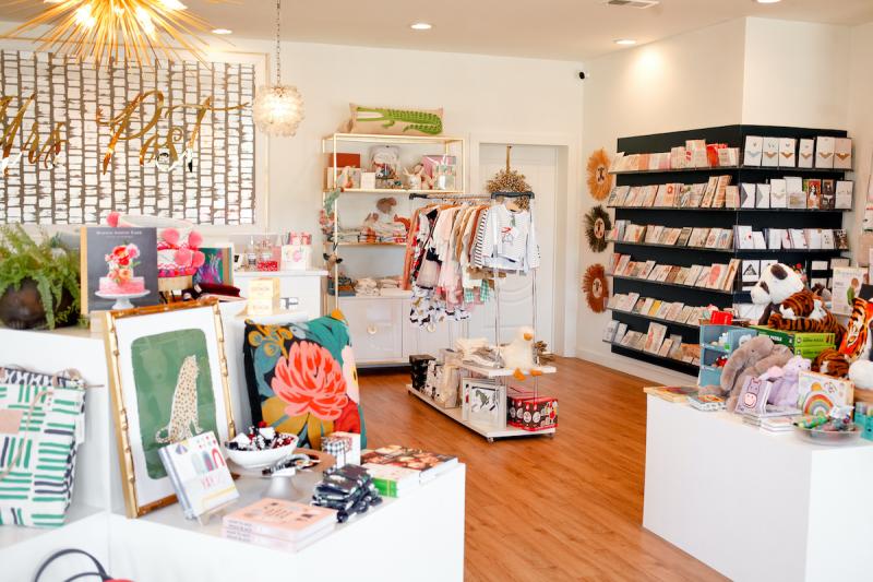 brightly lit gift shop interior with cards and art