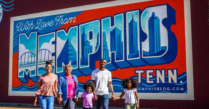 Family by Memphis mural in the Edge District