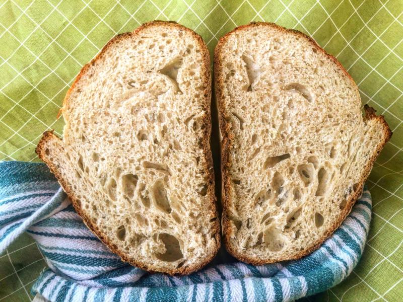 homemade sourdough bread loaf cut in half