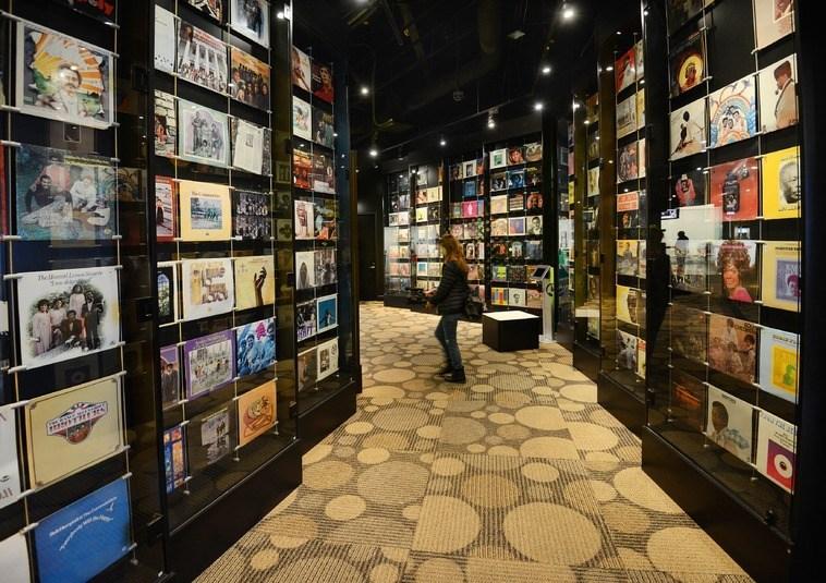 hallway with walls covered in record sleeves at the Stax Museum