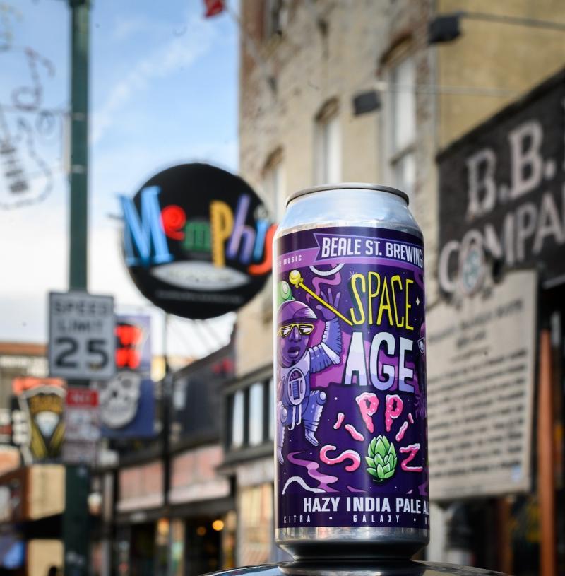 Tall beer can with purple "Space Age" label with Beale Street Memphis neon