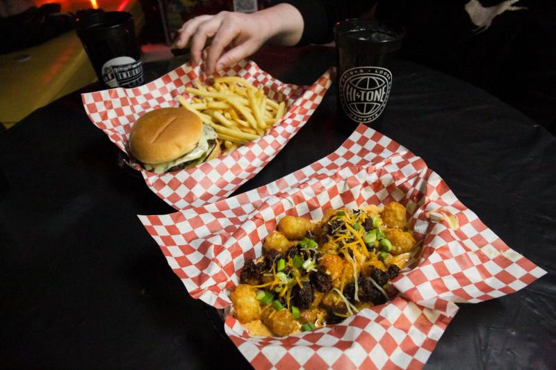 loaded tater tots and a burger with fries at the Hi Tone