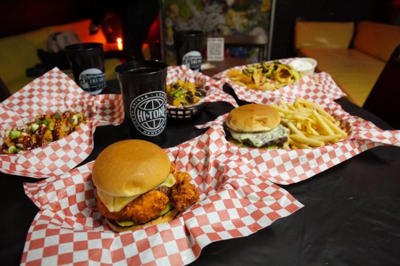 fried chicken sandwich, burger with fries, and other bar food