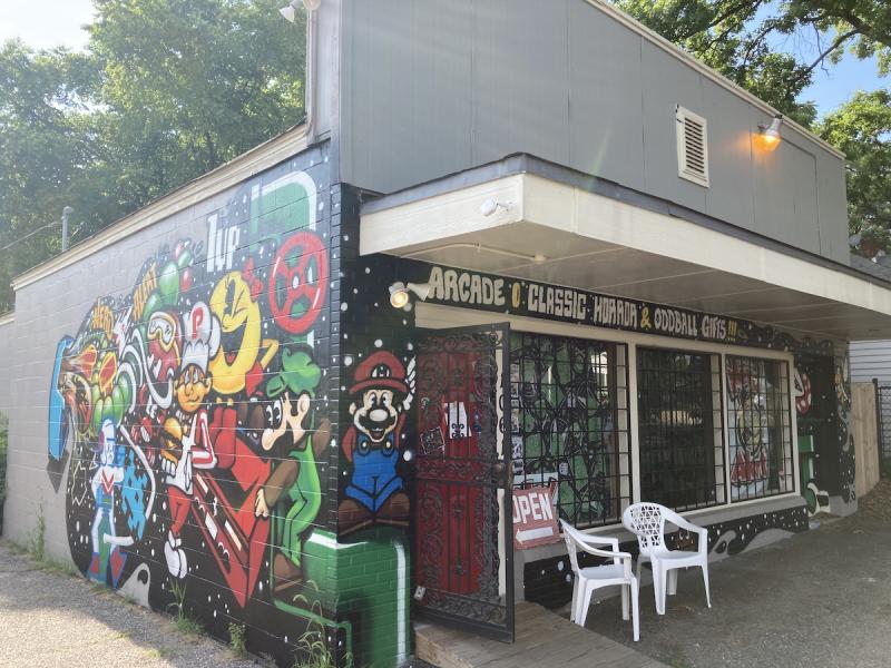 small shop with video game characters painted in a mural on the side