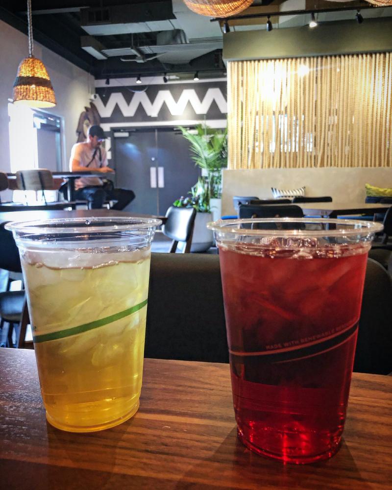iced green tea and iced hibiscus tea in a jungle-themed cafe