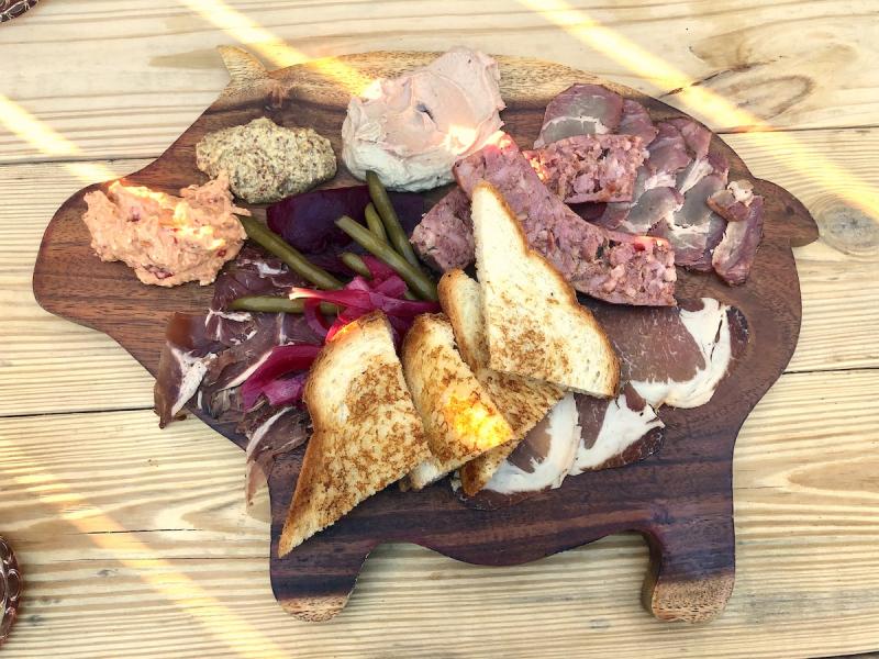meat and cheese board, board is shaped like a pig