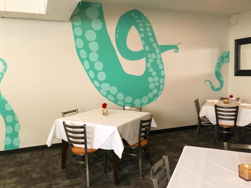 bari dining room with teal octopus tentacle