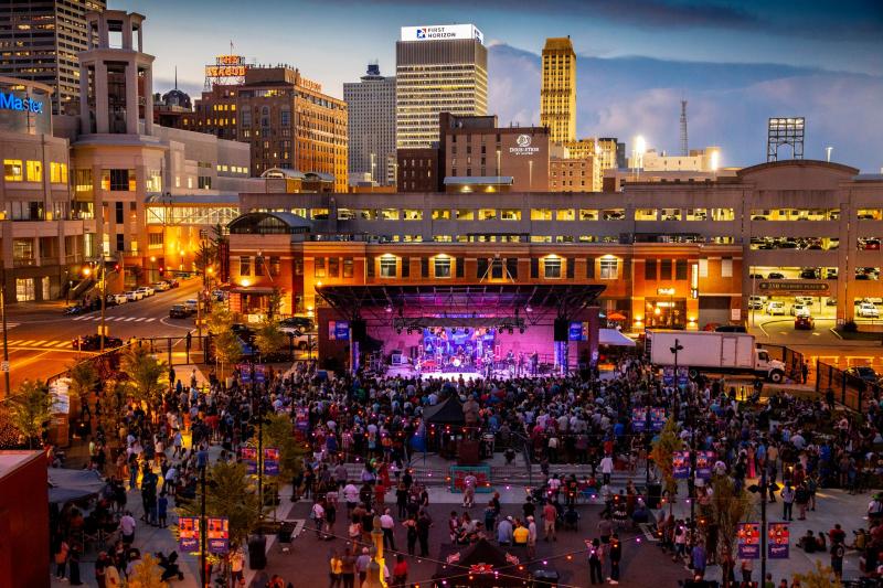 view of stage at Handy Park during outdoor live concert and downtown Memphis skyline