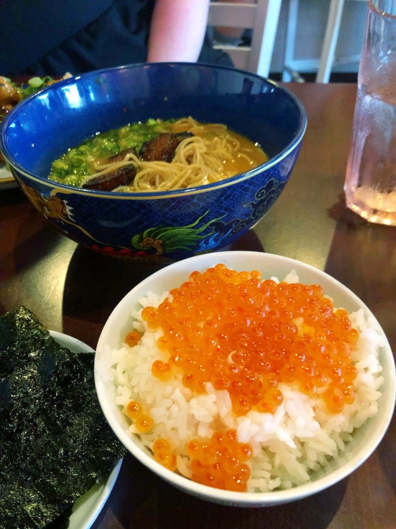 bowl of rice with bright orange salmon roe