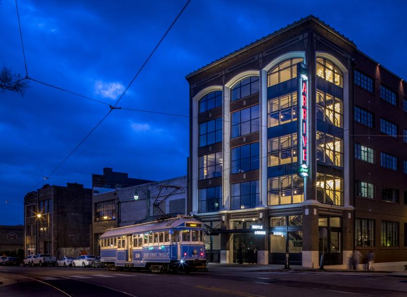 trolley driving by Arrive hotel