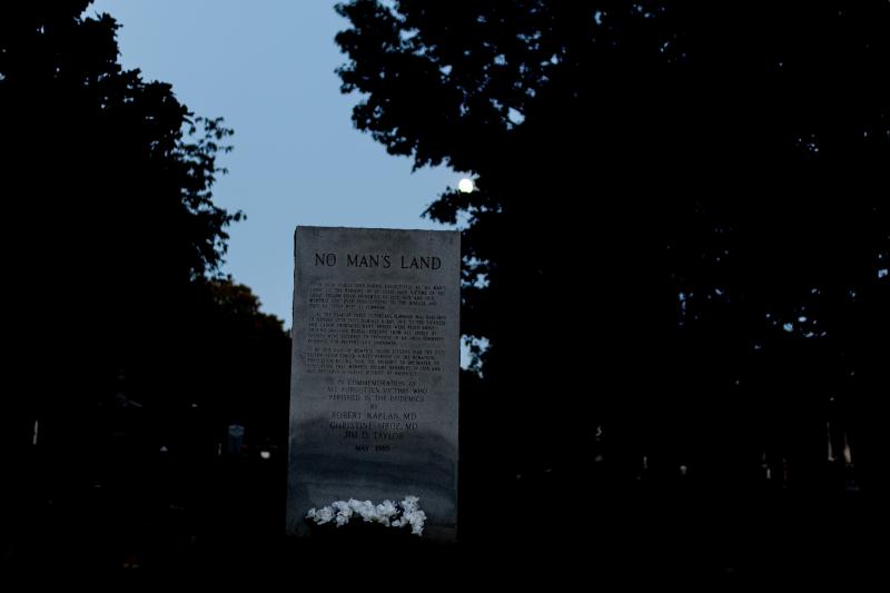 cemetery at night with monument stating No Mans Land