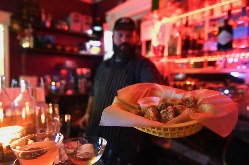 chef holding fried mushroom bites