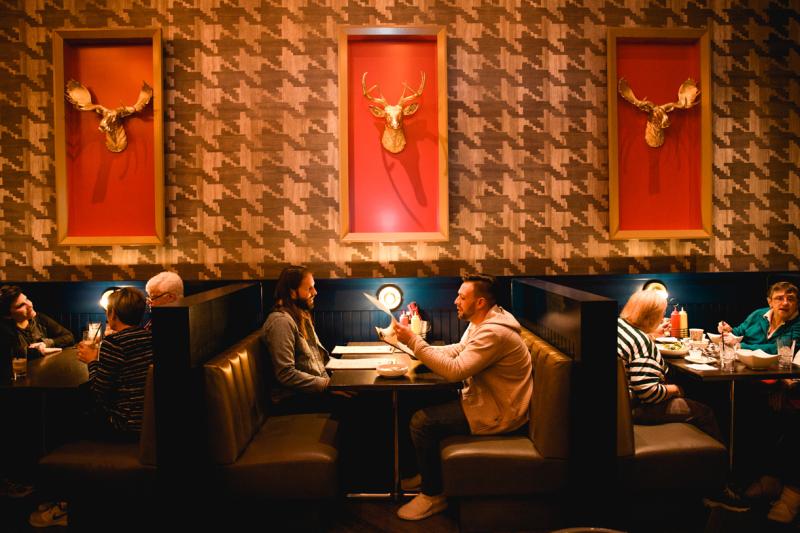 People sitting at booths at EP's Bar &amp; Grill