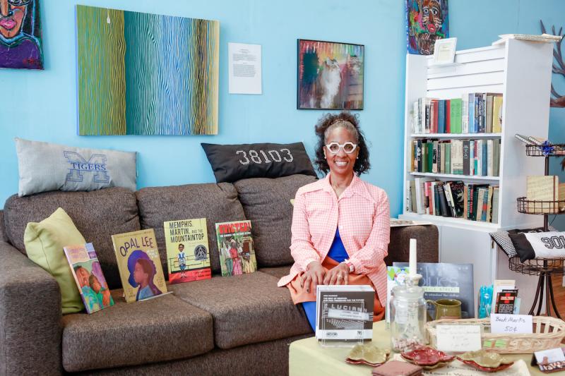 woman sitting on couch in bookstore