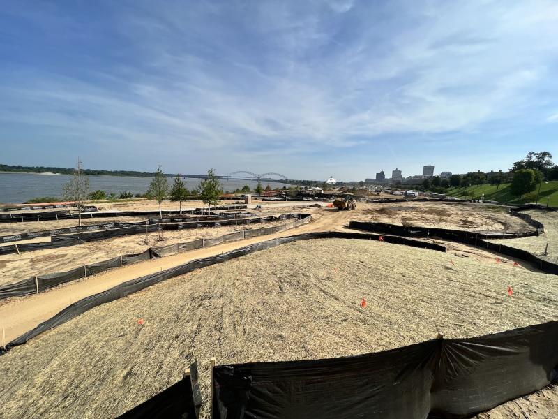 tom lee park construction mostly dirt with M bridge and river in background