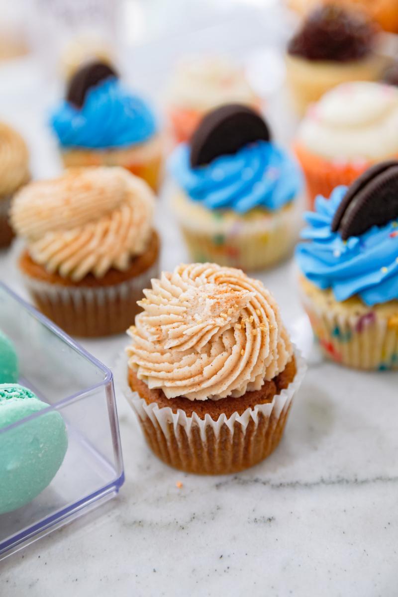 Various types of cupcakes at 17 Berkshire. Cupcake in blue frosting with Oreo sticking out of it