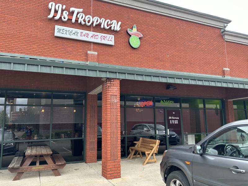 Exterior photo of JJ's Tropical. Brick building in strip mall